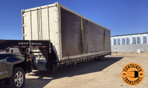 Container on a trailer of a truck.