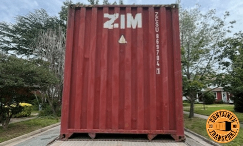 Moving a 40 Foot Loaded Container on a Step Deck trailer.