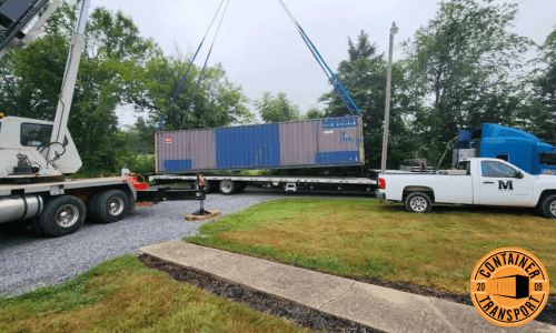 Crane loading container onto trailer.