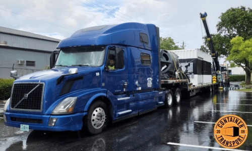 Crane loading container onto trailer.