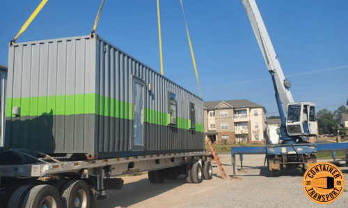Crane unloading Container onto Trailer.
