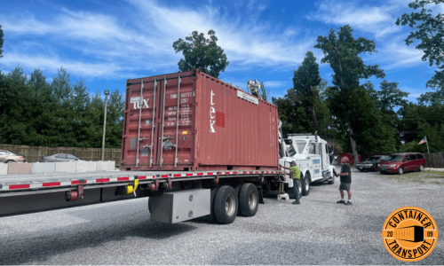 Crane lifting 20ft Container onto Trailer.