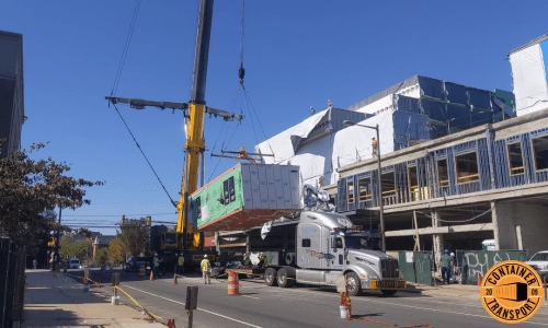 Crane unloading a Container on a trailer.