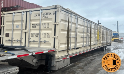 Container on a step deck trailer.