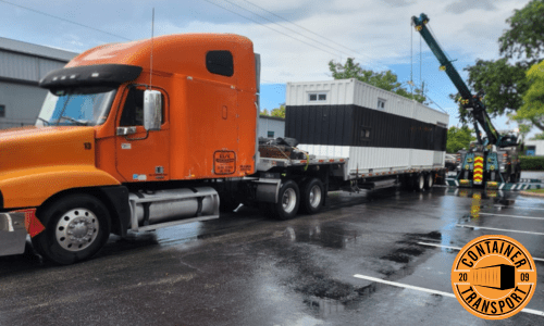 Shipping Container lifted by Crane onto Trailer.