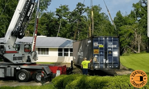Crane lifting and loading Container on trailer.