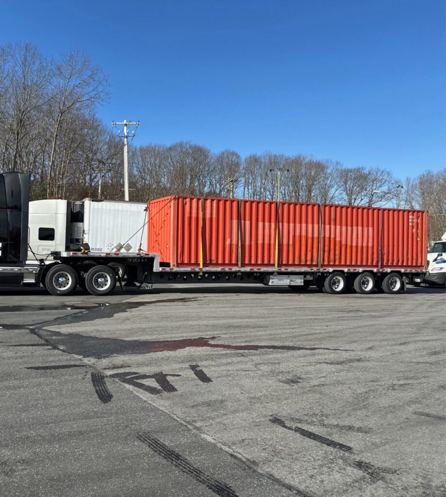 Project cargo container transported on a trailer.