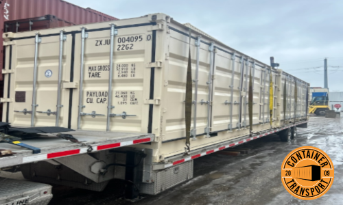 Container on a step deck trailer.