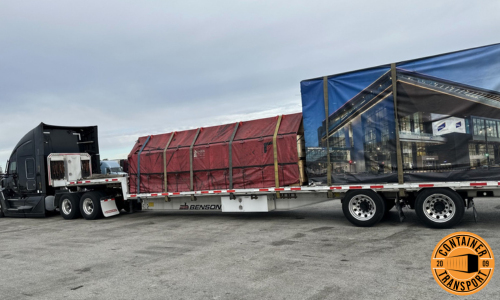 Container shipped on a step deck trailer.