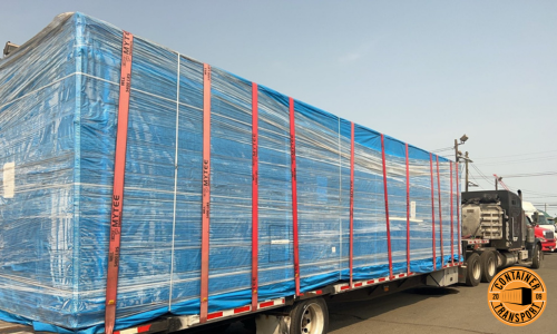 Container on a step deck trailer.