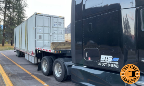 Container on a Step Deck trailer.