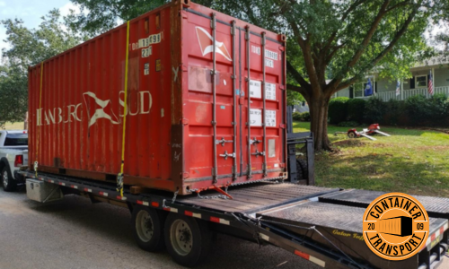 Red container being transported.