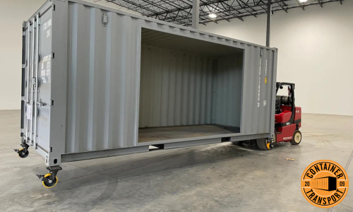 Forklift lifting container for transport.