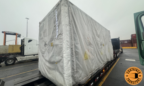 Container on a RGN trailer for transport.