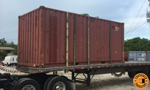 Transporting a Container on a Flatbed trailer.