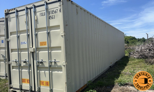 Container on the ground getting ready to be transported.