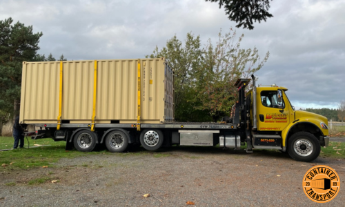 Transporting a 20ft container on a Flatbed trailer.