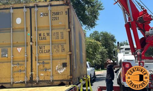 Crane loading a container