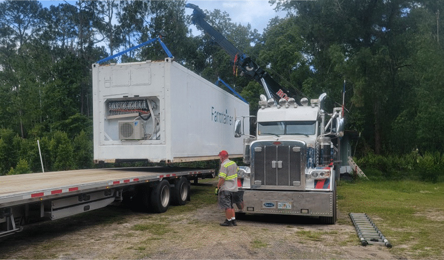 Crane loading a container