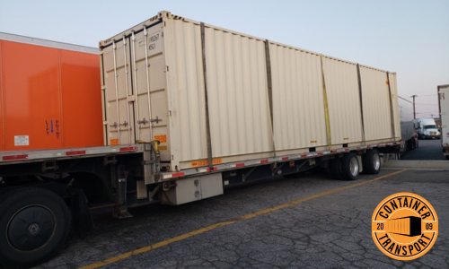Container loaded onto trailer ready to be transported.