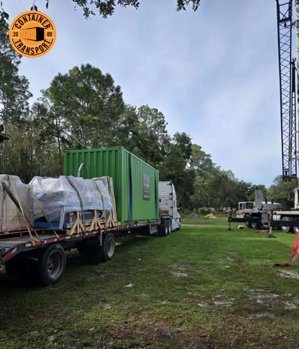 Container being transported in green field